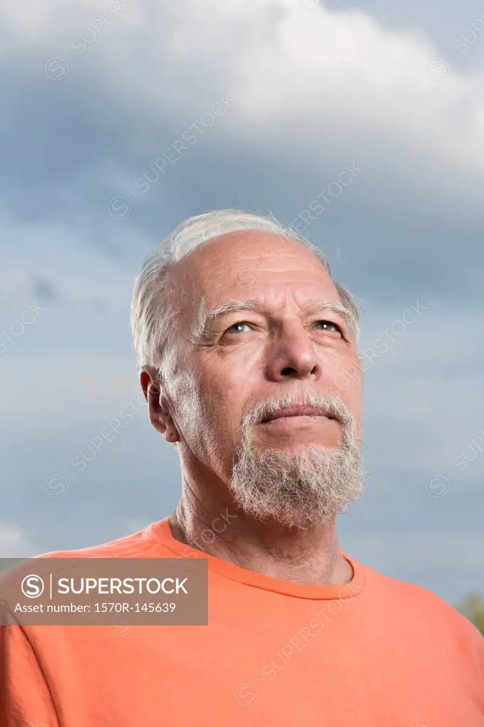 Senior man looking up, close-up