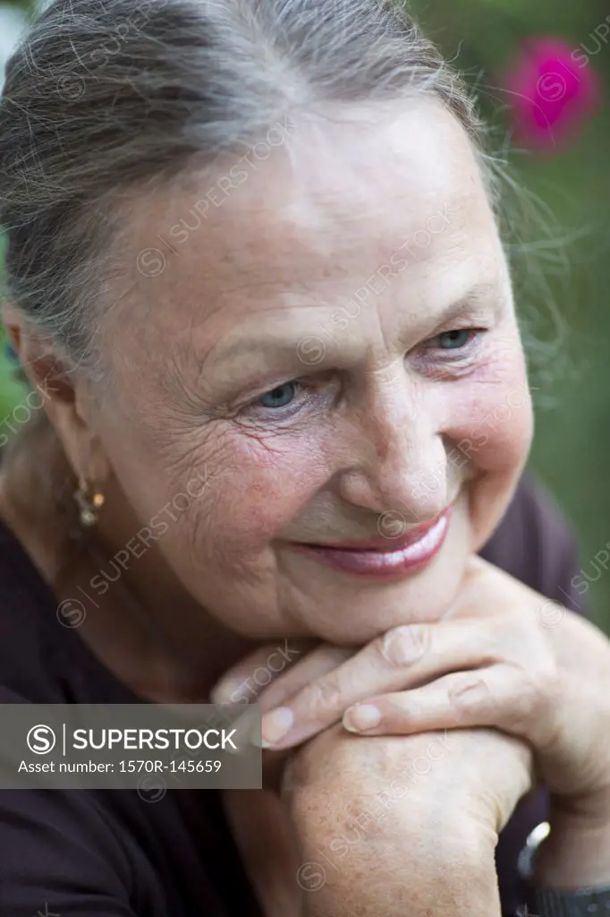 Senior woman looking down, close-up