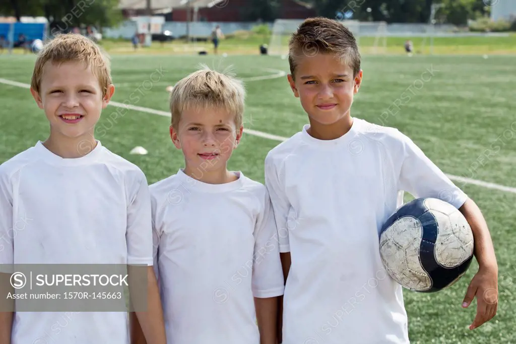 Portrait of boys with football