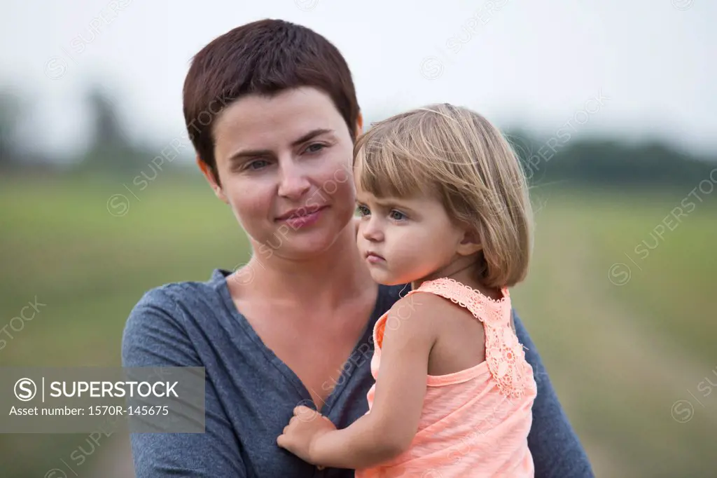 Mother holding daughter