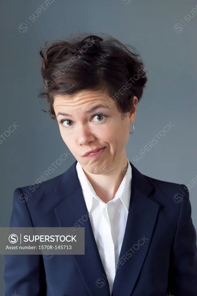 Portrait of mid adult woman making funny face, close-up