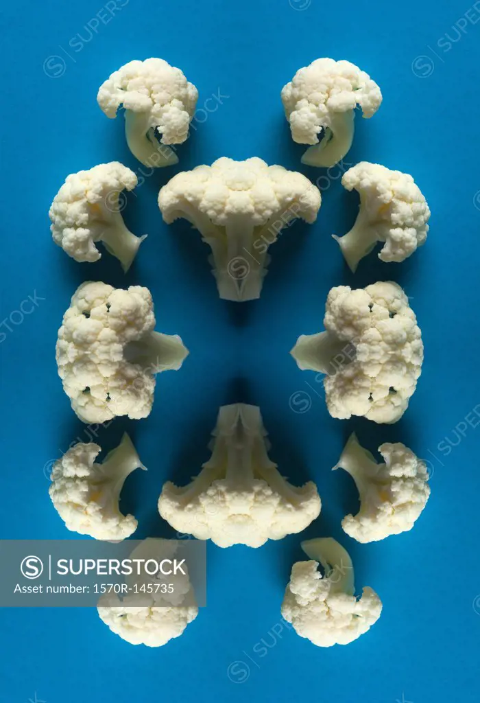 A digital composite of mirrored images of an arrangement of pieces of cauliflower