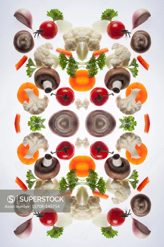 A digital composite of mirrored images of pieces of mixed vegetables