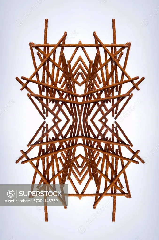 A digital composite of mirrored images of an arrangement of pretzels