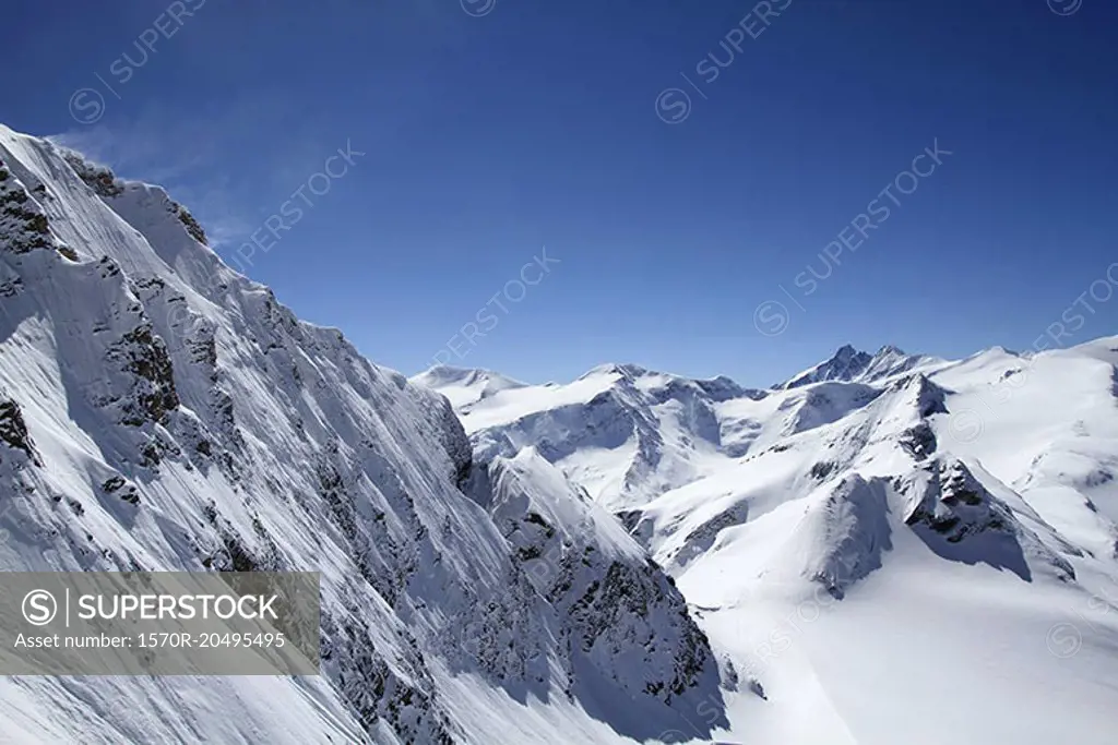 Snowcapped mountain against blue sky