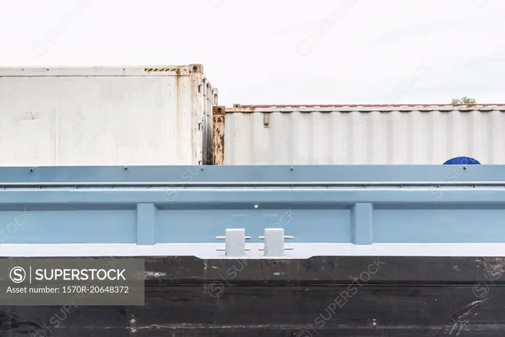 Low angle view of cargo containers at port