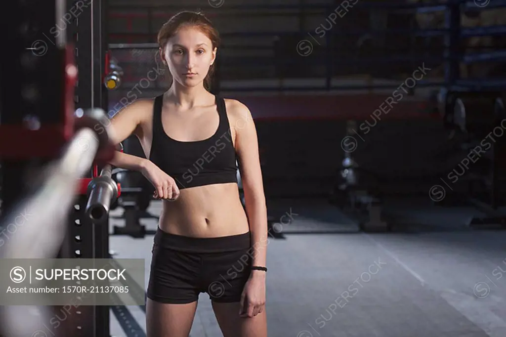 Portrait of athlete standing at gym