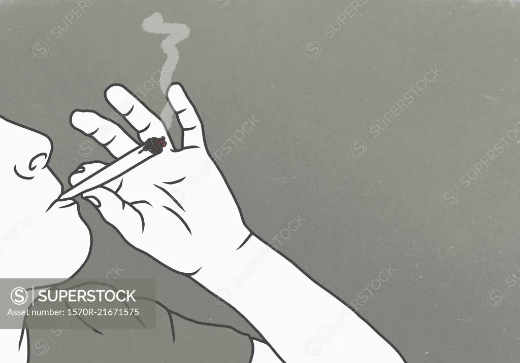 Cropped image of man smoking marijuana against gray background