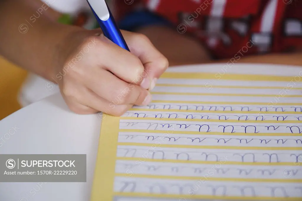 Child practicing cursive handwriting