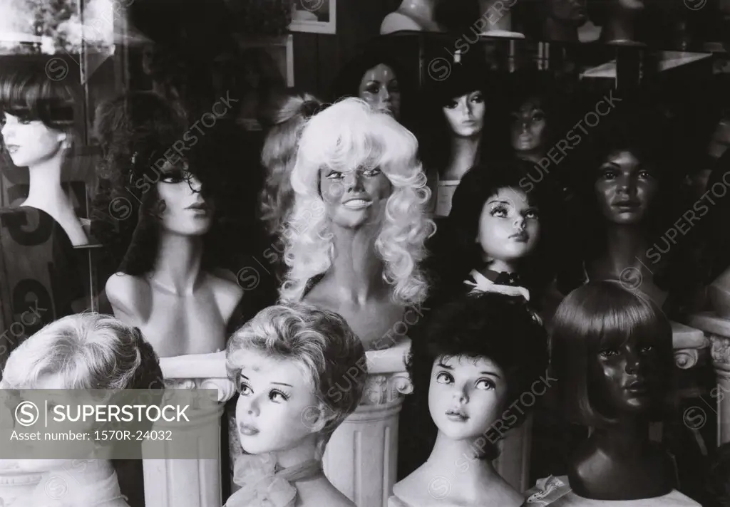 Mannequins with wigs in a wig shop