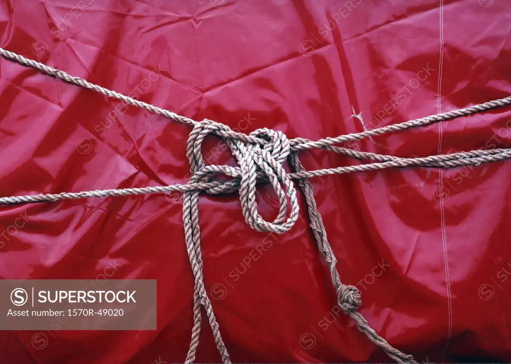 red plastic tied with rope