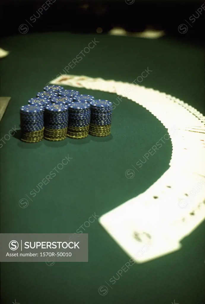 chips and cards spread out on a casino table
