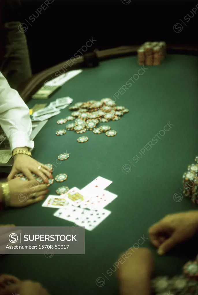 people playing blackjack at a casino