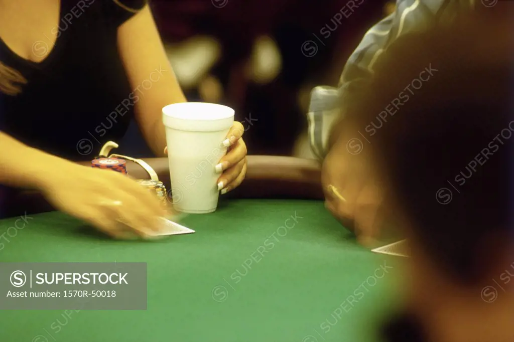 woman playing blackjack at a casino