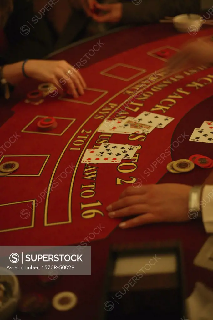 Detail of people playing blackjack