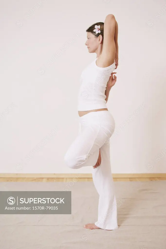A woman in a yoga pose