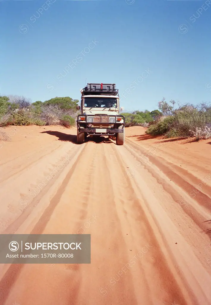An off-road vehicle on a desert road in Australia