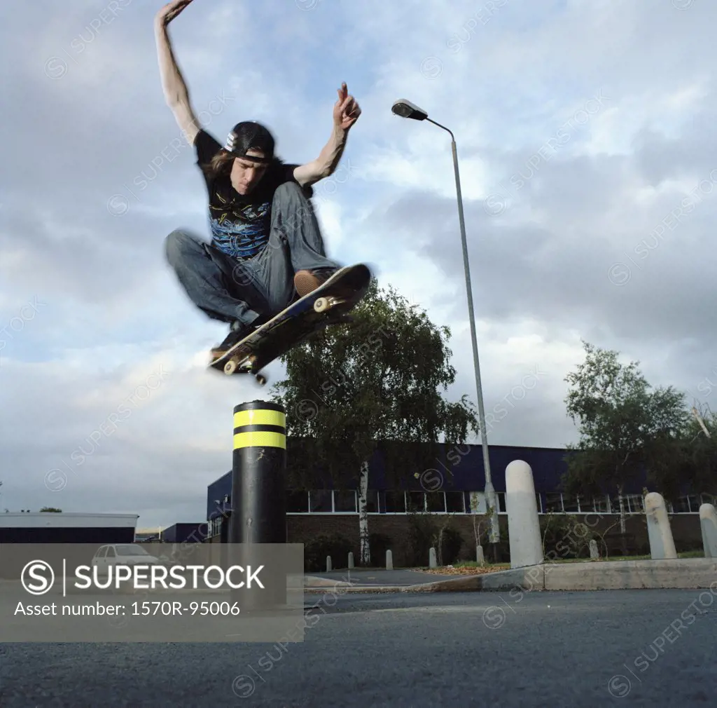 Man on skateboard jumping in air