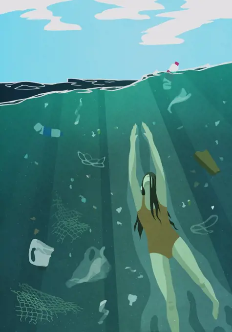 Woman swimming underwater in ocean surrounded by pollution