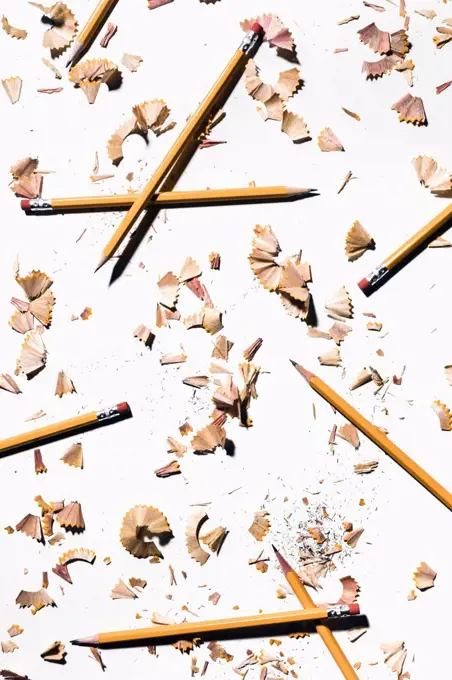 Pencils and shavings on white background