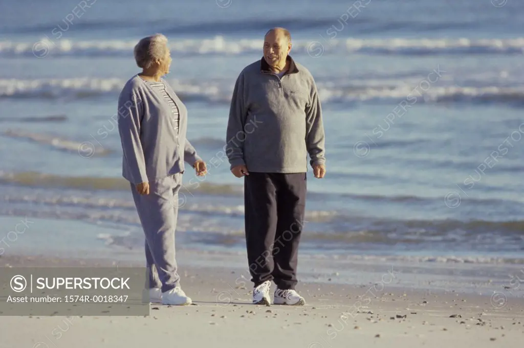Senior couple standing on the beach