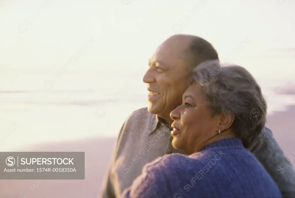 Close-up of a senior couple embracing on the beach