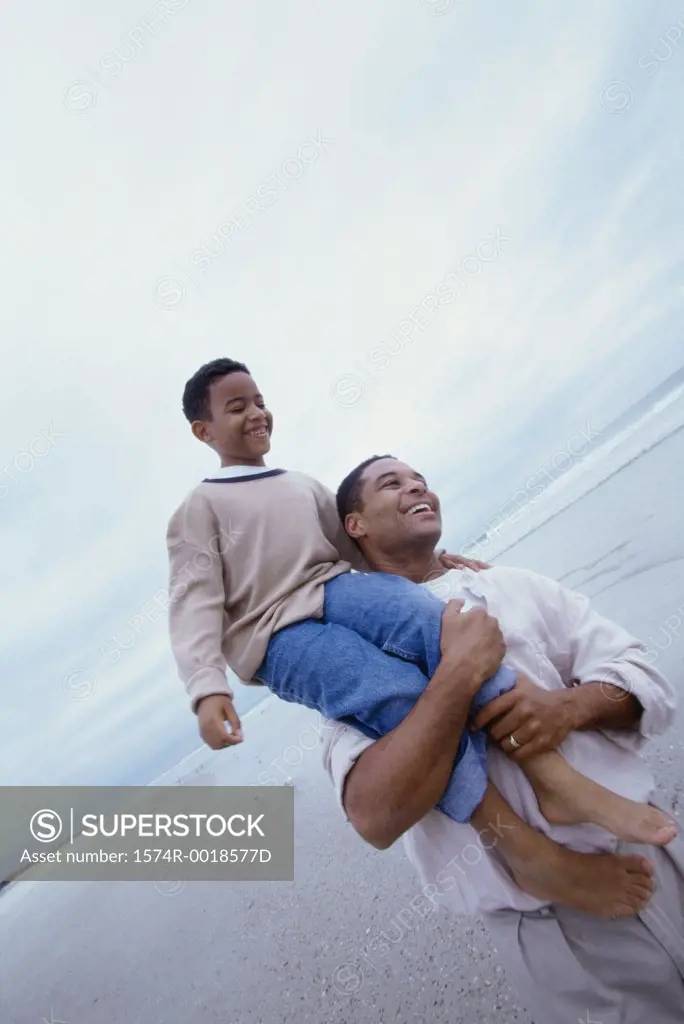 Father carrying his son on his shoulders