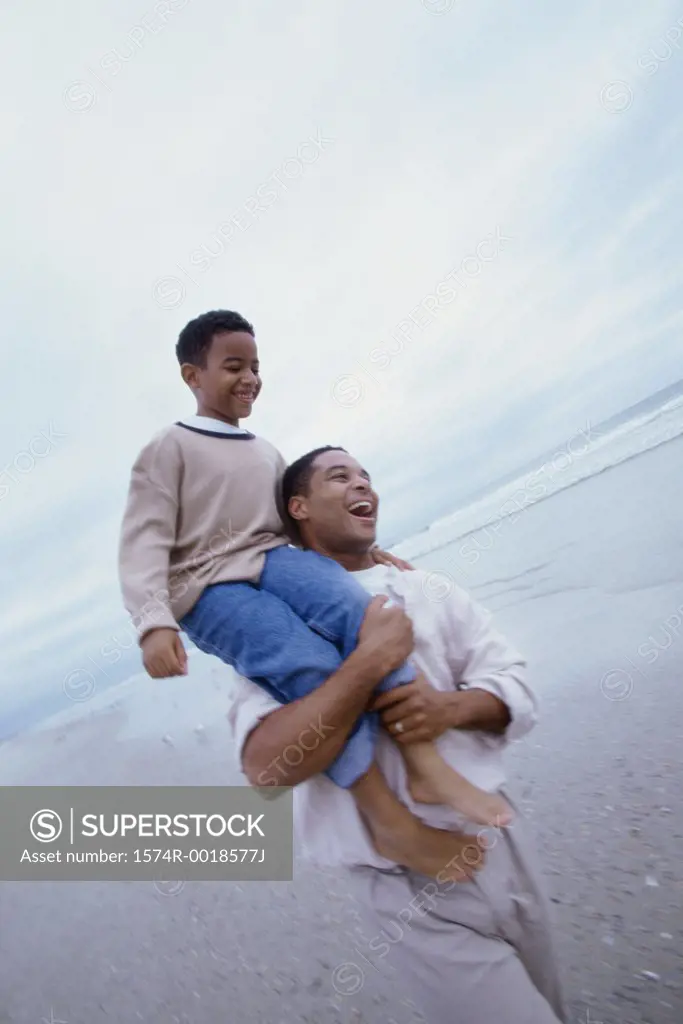 Father carrying his son on his shoulders