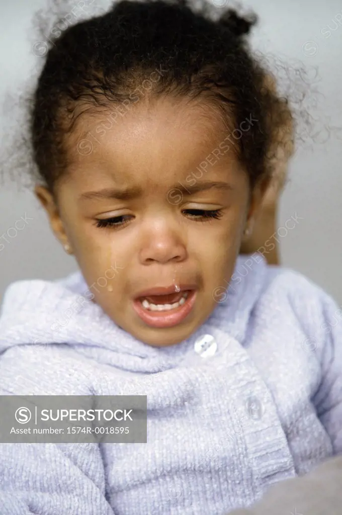 Close-up of a girl crying