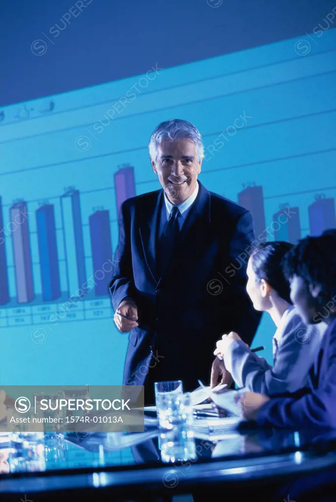 Business executives at a presentation in the conference room