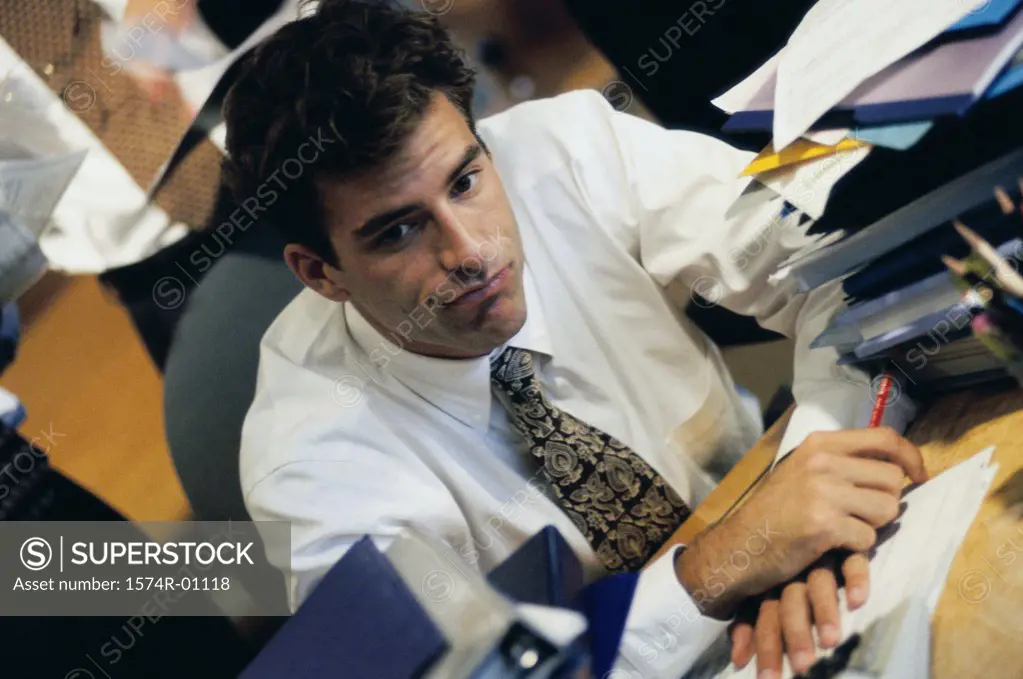 Young businessman sitting at his desk at work
