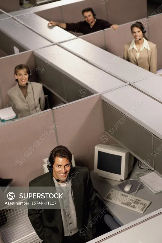 Portrait of customer service representatives in cubicles