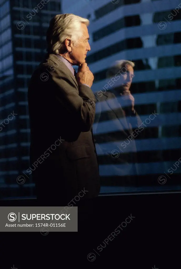 Businessman looking out of a window