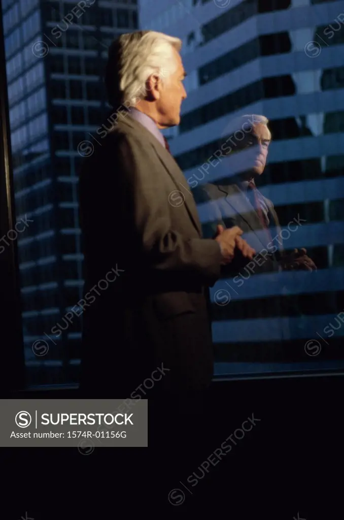 Businessman looking out of a window