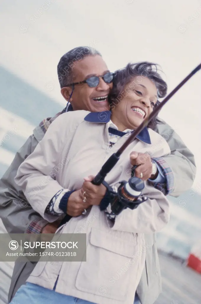 Mature couple fishing together