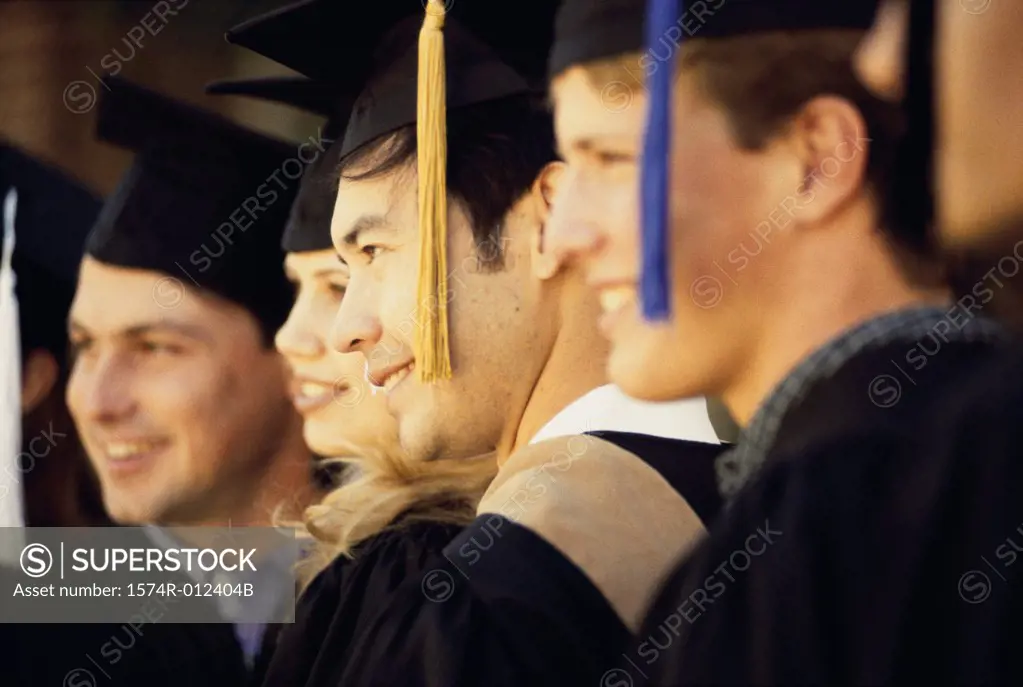 Group of young graduates standing together
