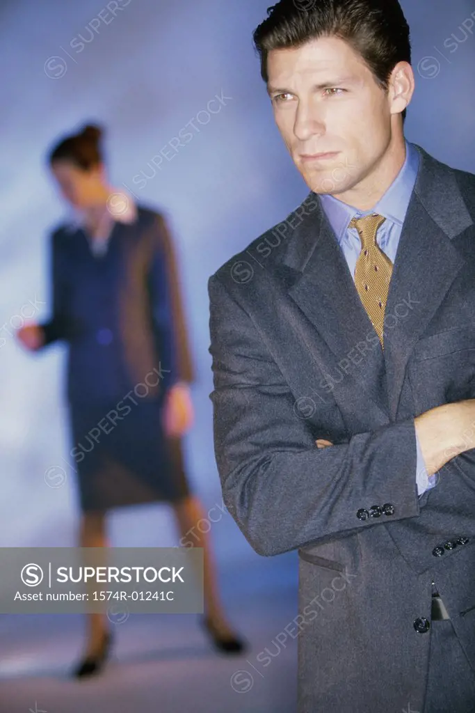 Portrait of a businessman with a businesswoman behind her