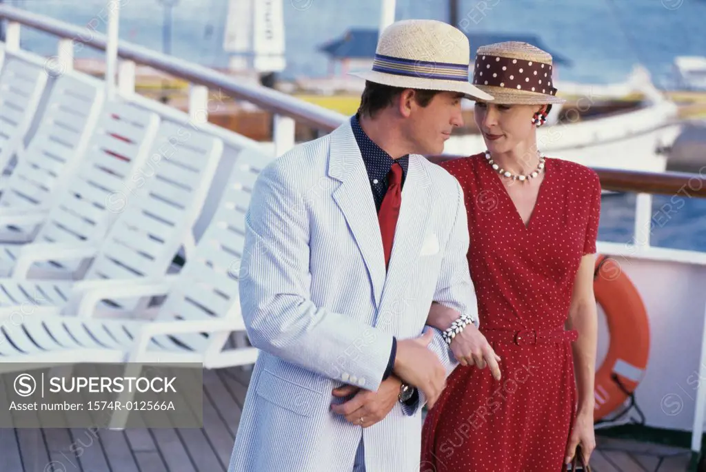 Close-up of a young couple looking at each other on a cruise ship