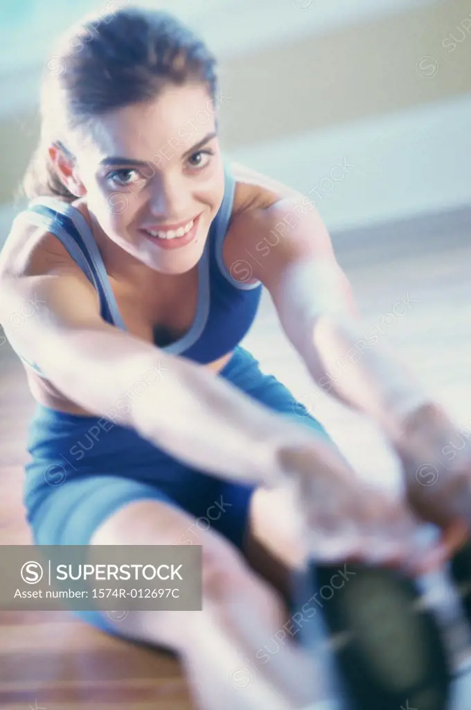 Portrait of a young woman exercising