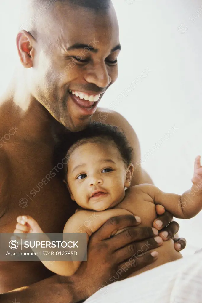 Close-up of a father playing with his son
