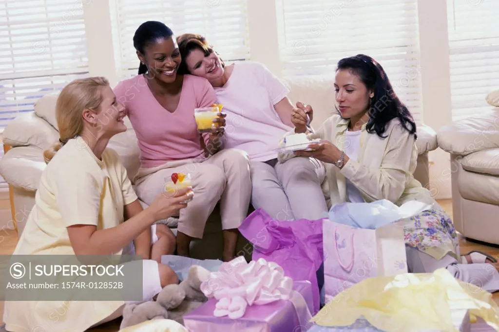 Four young women at a baby shower