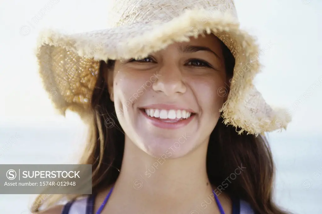 Portrait of a teenage girl wearing a hat