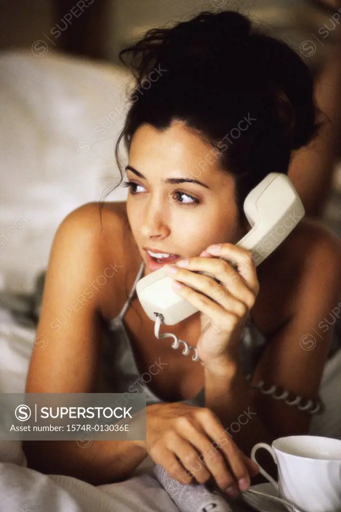 Close-up of a young woman talking on the telephone