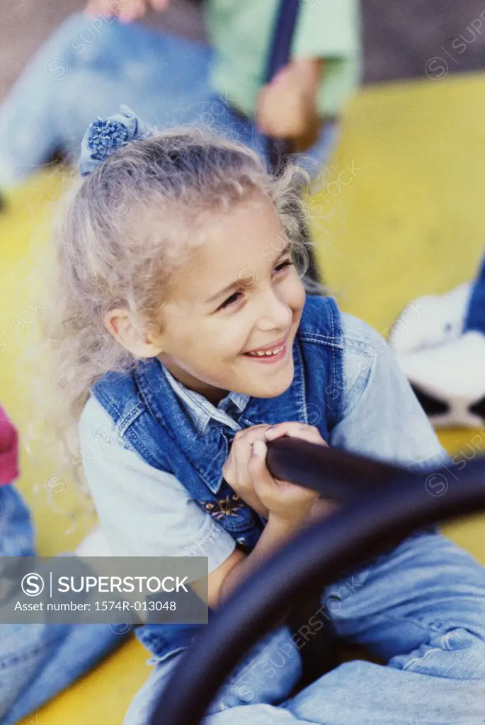 Close-up of a girl on a merry-go-round