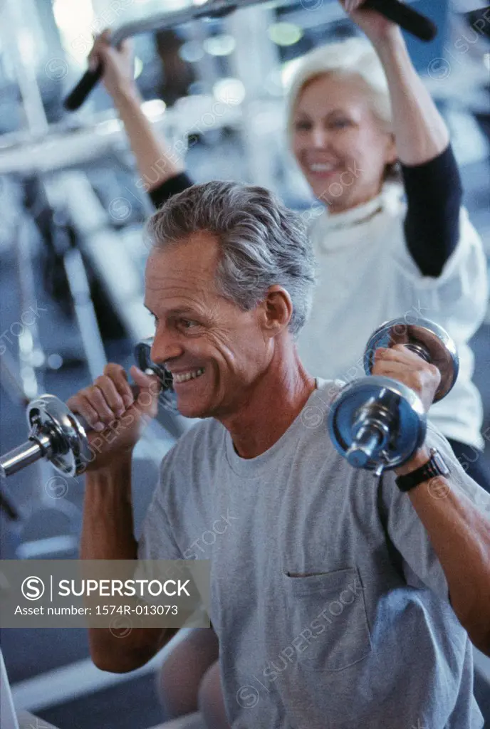 Senior couple exercising in a gym