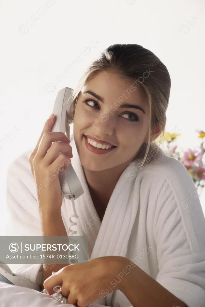 Close-up of a young woman talking on the telephone