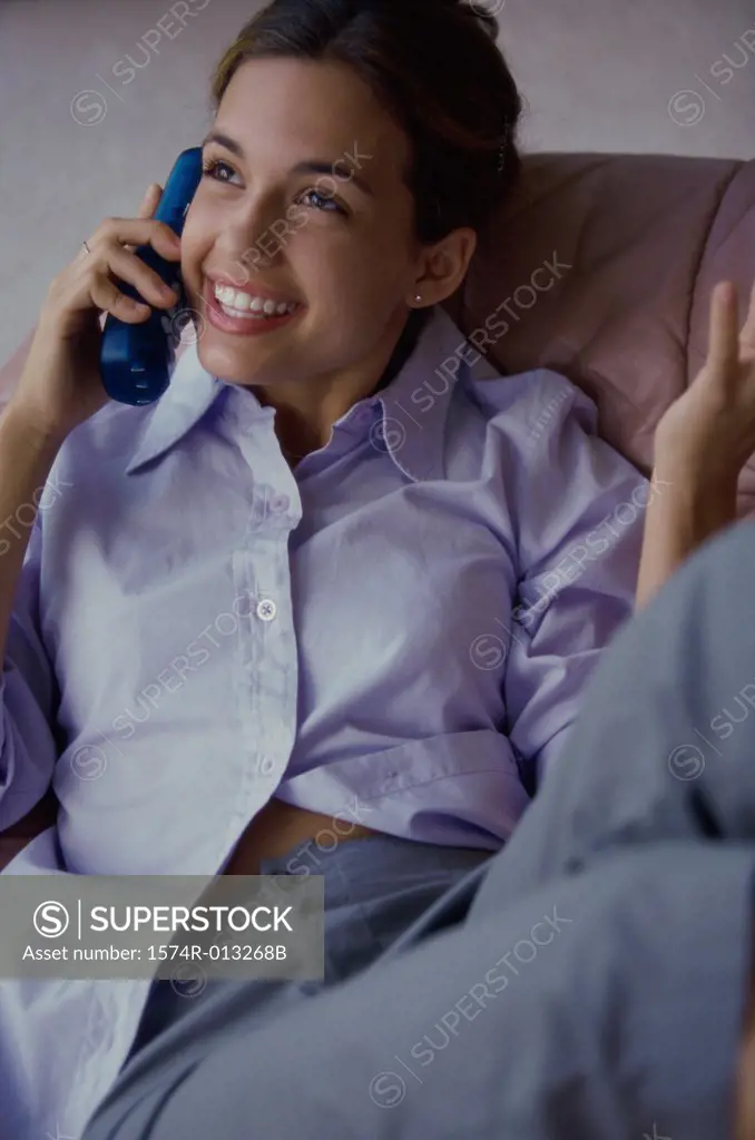 Close-up of a teenage girl talking on a phone