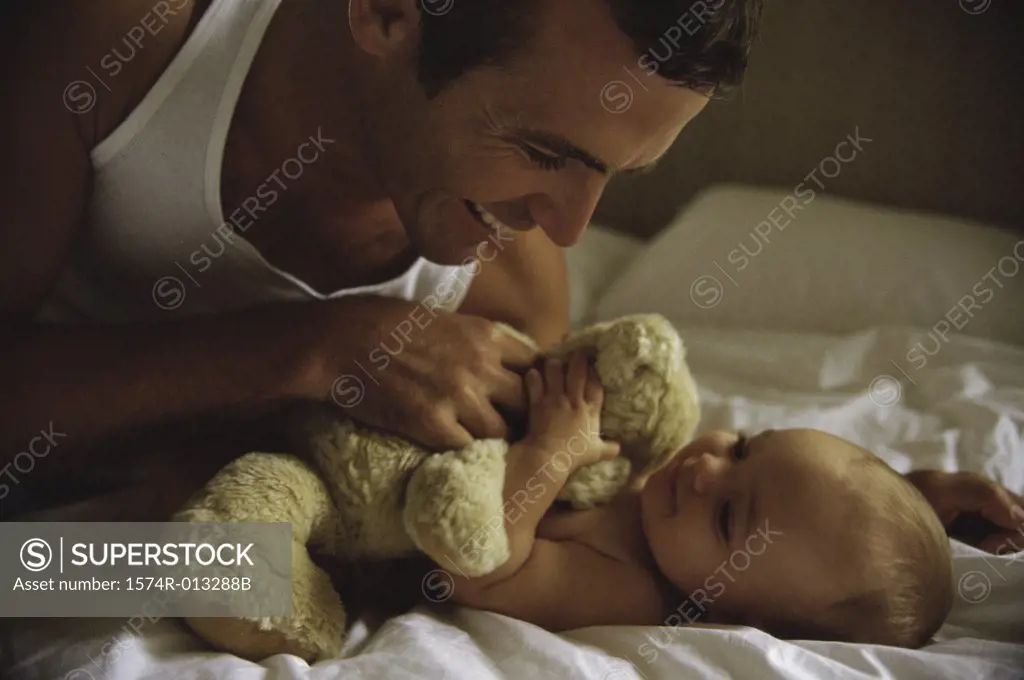 Close-up of a father playing with his daughter
