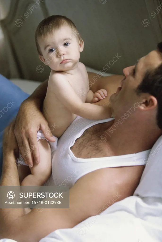 High angle view of a father holding his daughter