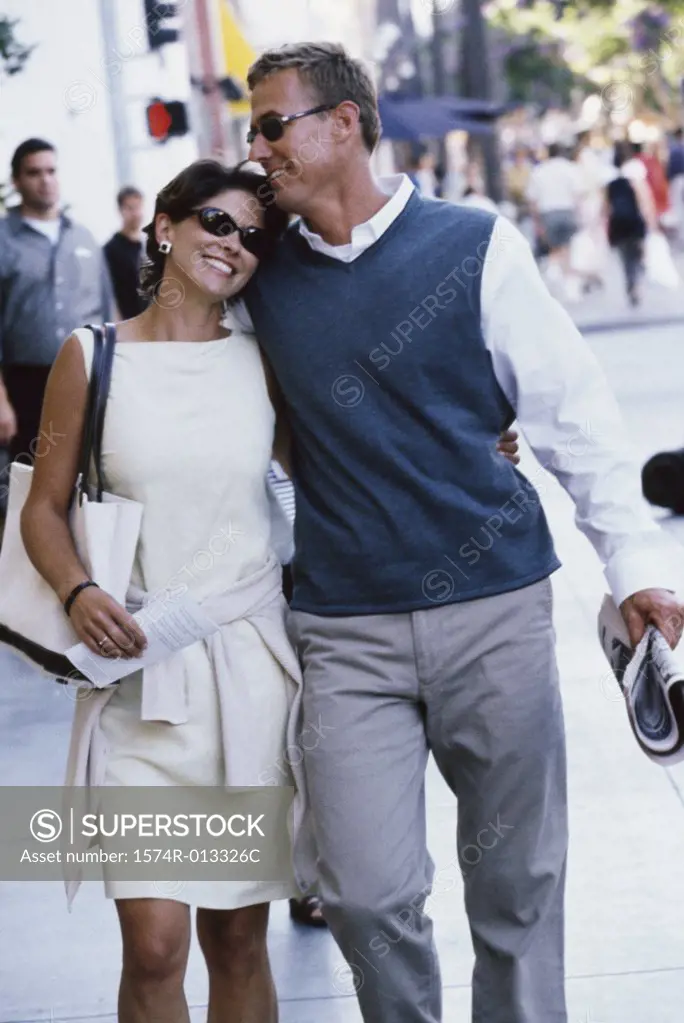 Mid adult couple walking together